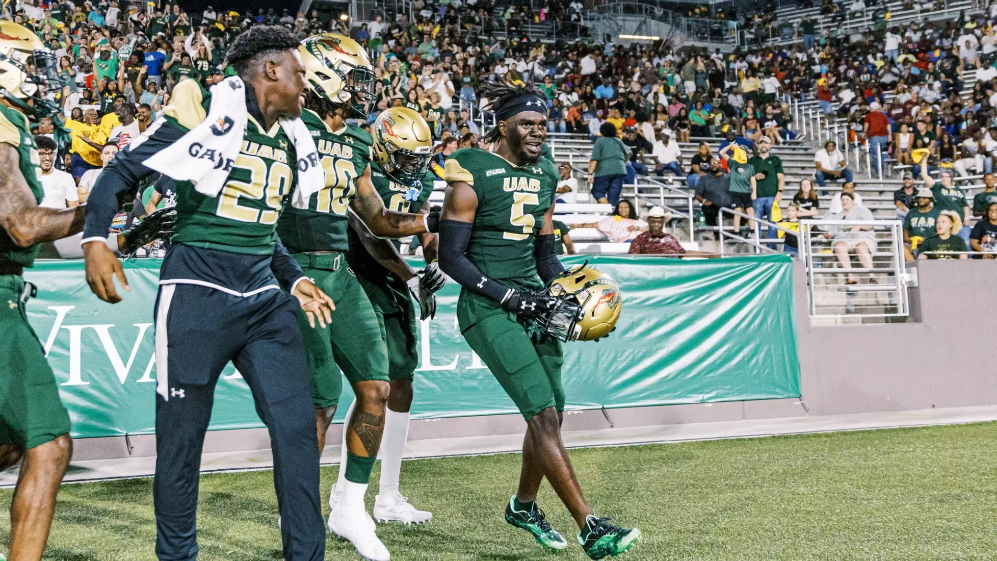 BIRMINGHAM, AL - AUGUST 31: The UAB Blazers run onto the field for the game  between the UAB Blazers and the North Carolina A&T Aggies on August 31,  2023 at Protective Stadium